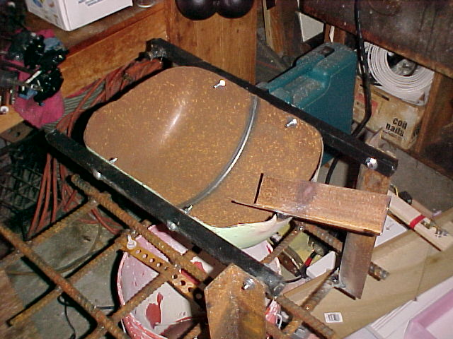 welded angle iron pouring spout into interior of reverb furnace.jpg